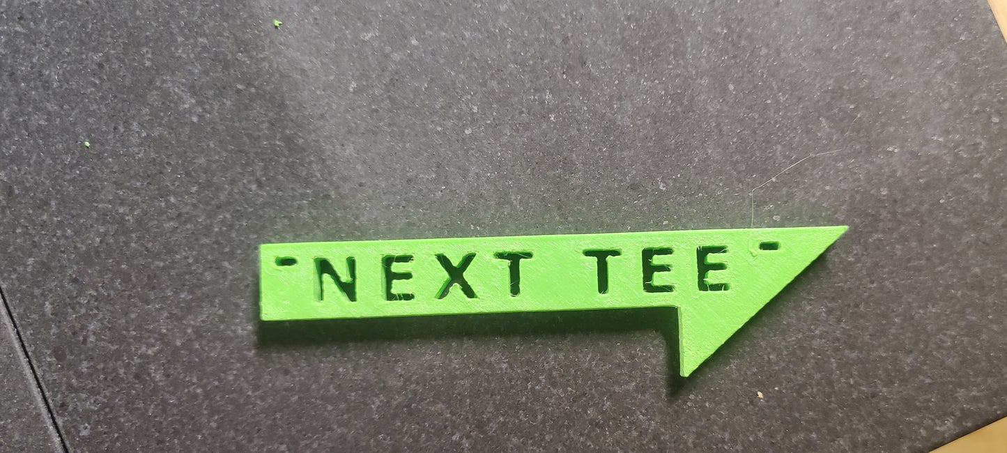 Next Tee Sign.