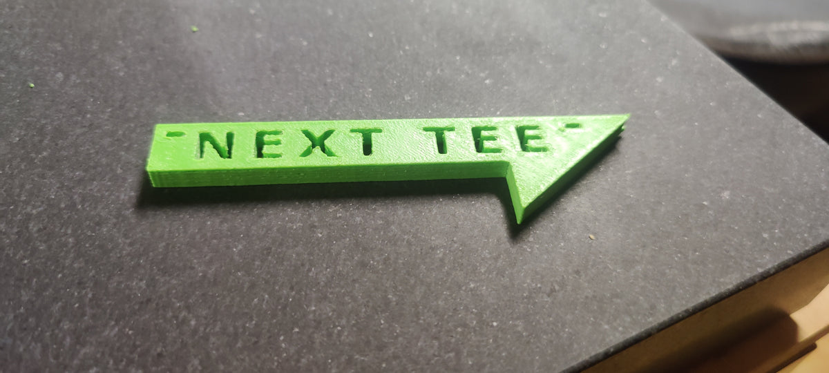 Next Tee Sign.