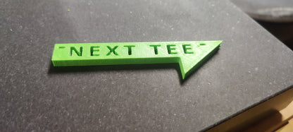 Next Tee Sign.